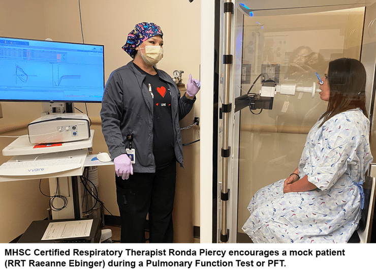 MHSC Certified Respiratory Therapist Ronda Piercy encourages a mock patient (RRT Raeanne Ebinger) during a Pulmonary Function Test or PFT.