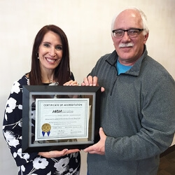 MHSC Cardiopulmonary Services Director Crystal Hamblin and Dr. Patrick Plummer display the hospital’s Certificate of Accreditation from the American Academy of Sleep Medicine.