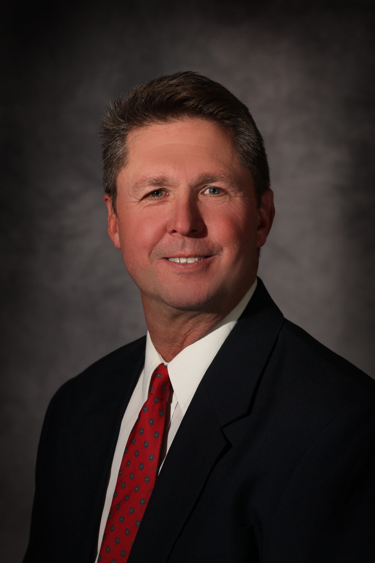 Taylor Jones, a middle-aged man with brown hair 