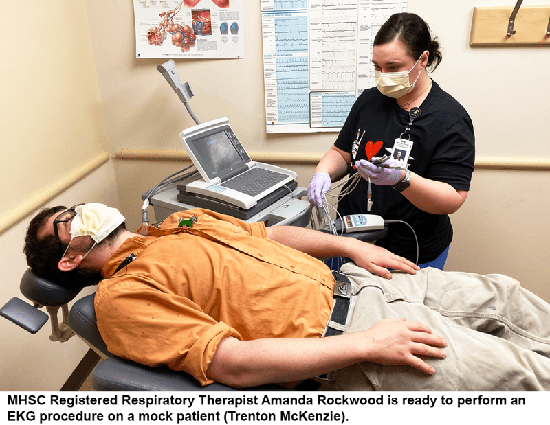 MHSC Registered Respiratory Therapist Amanda Rockwood is ready to perform an EKG procedure on a mock patient (Trenton McKenzie).