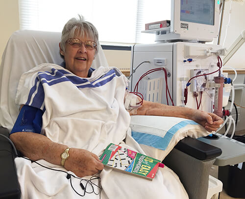 female patient receiving dialysis