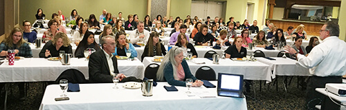 Kevin Franke, a quality improvement specialist with Mountain-Pacific Quality Health, talks about Chronic Care Coordination to more than 75 people during a community luncheon in April.