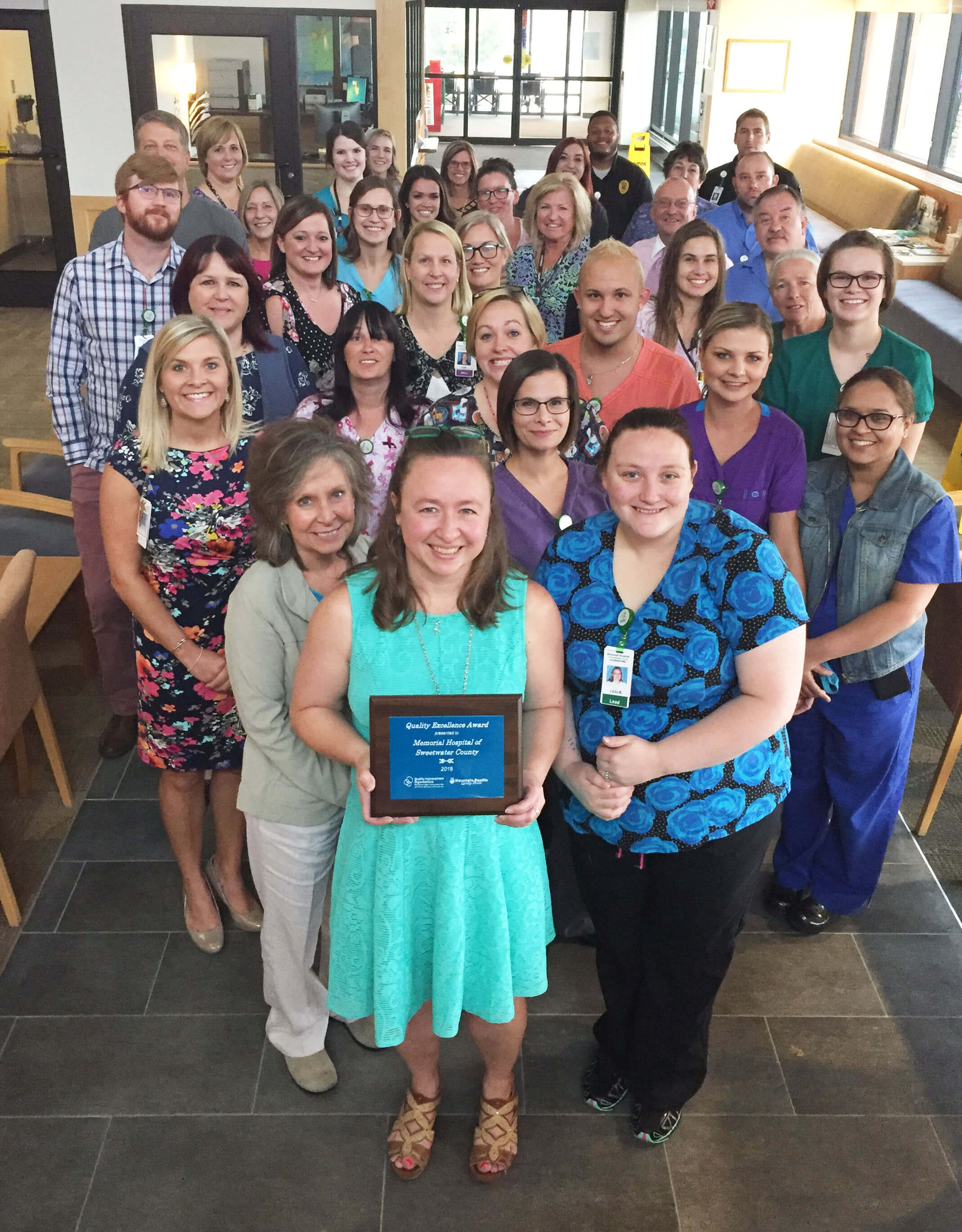 a few of Sweetwater Memorial’s staff, leaders and providers holding the Hospital Quality Excellence Award